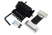 Black guitar tremolo bridge assembly - front angled view with mounting hardware and adjustment wrench