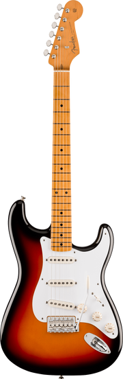 Electric guitar with a sunburst finish on a beige background