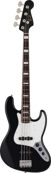 Black electric bass guitar on a brown background